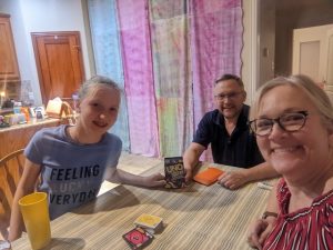 Playing Uno Flip in our dalla Airbnb, day 9